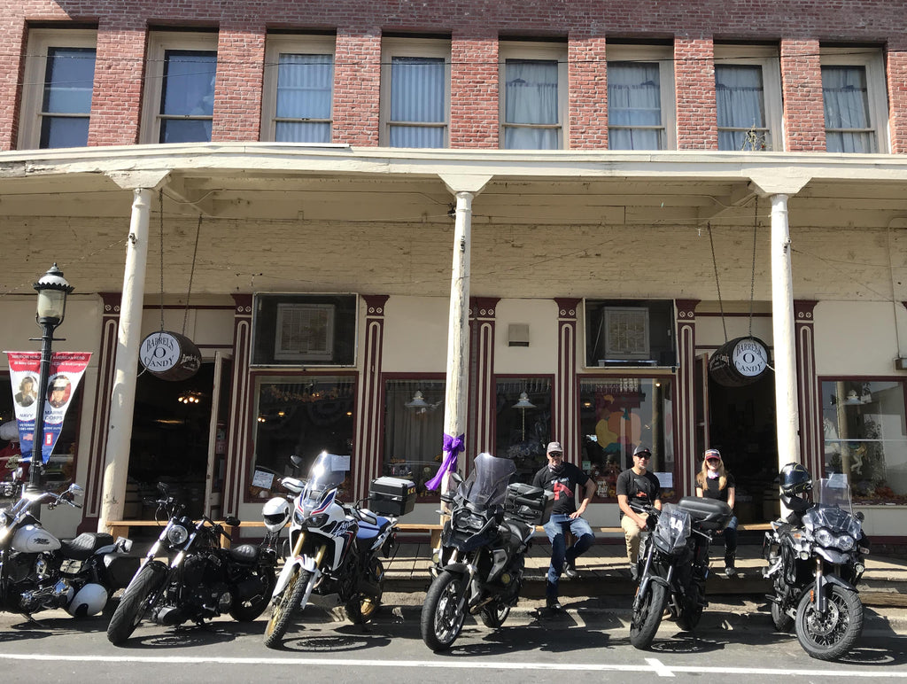 motorcyclists hanging by their moto in Virginia City Nevada California USA guided motorcycle tour ride 
